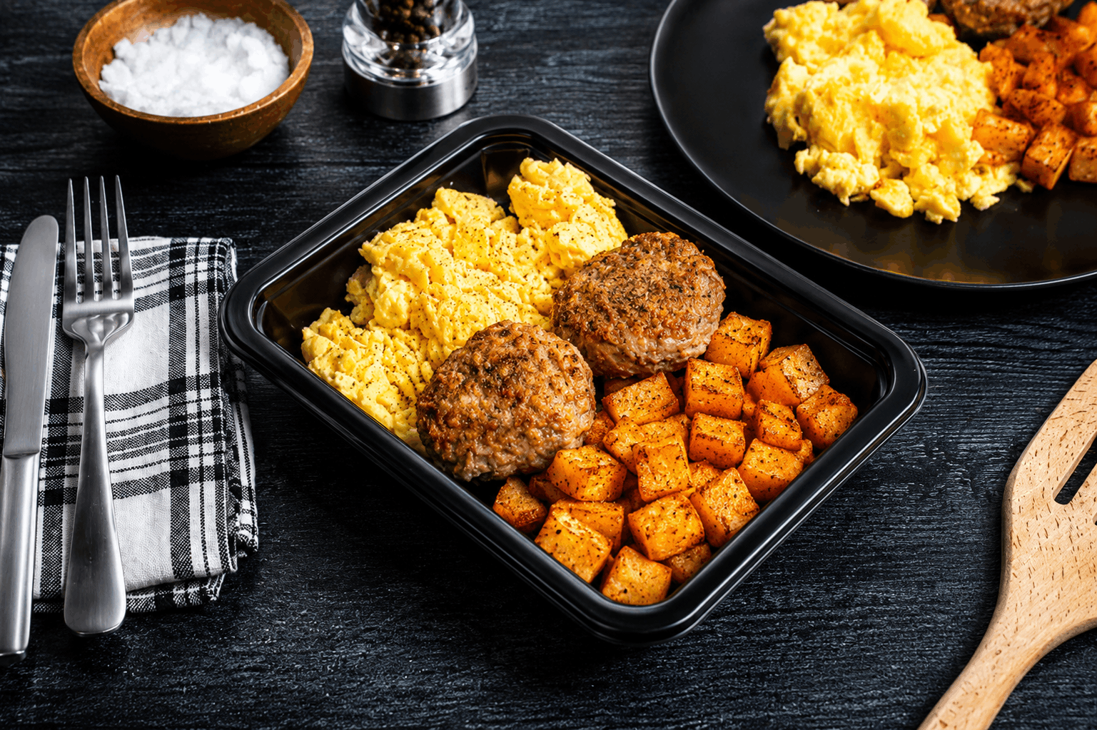 Fresh-ground, handcrafted chicken sausage patties seasoned to perfection and oven-finished, served alongside fluffy scrambled eggs and crispy roasted potatoes.