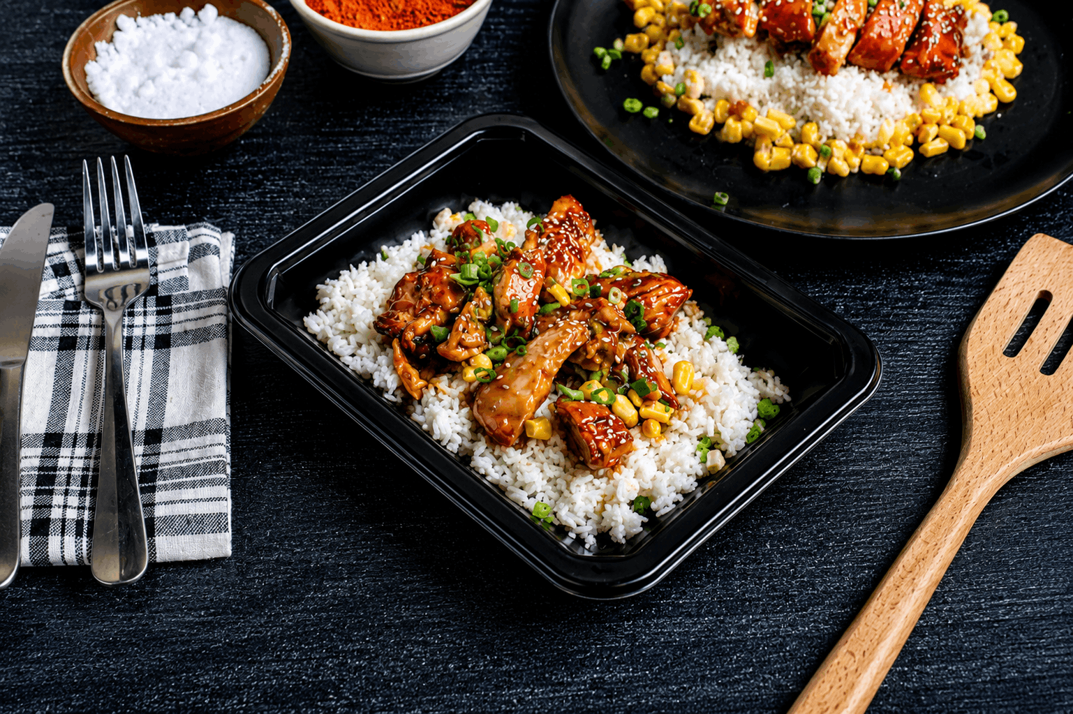 Juicy, hormone-free skinless chicken thighs tossed in our signature sweet-and-spicy bourbon glaze, served with jasmine rice, tender sweet corn, and topped with fresh scallions.