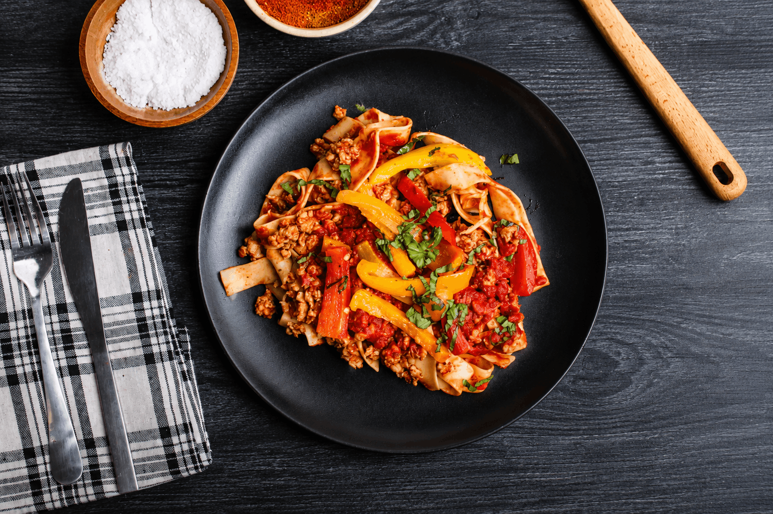 Pappardelle pasta tossed with spicy Italian chicken sausage, sweet bell peppers, and onions in a rich tomato and white wine sauce. Finished with fresh basil and Parmesan for a bold, rustic Italian flavor.