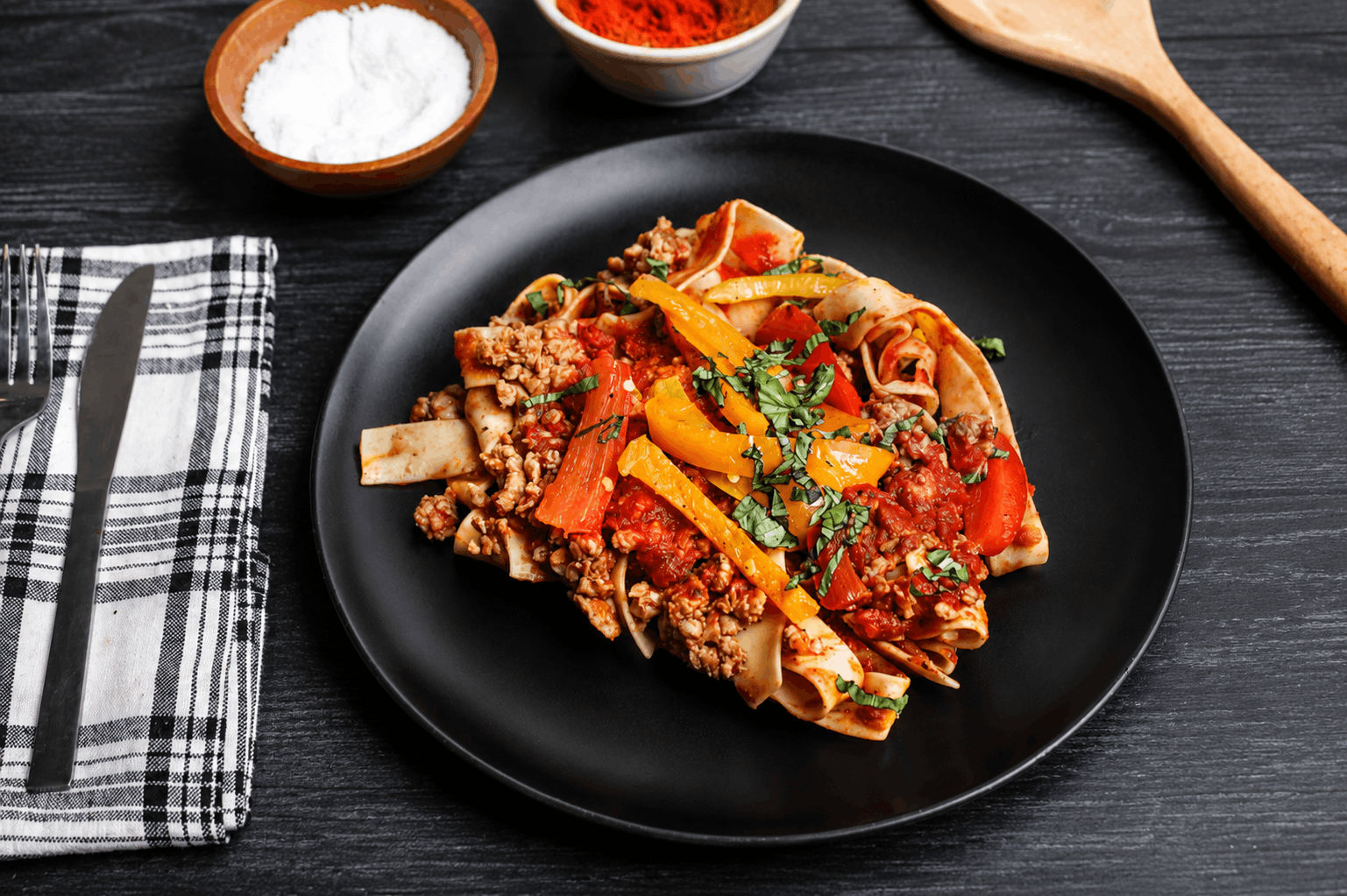 Pappardelle pasta tossed with spicy Italian chicken sausage, sweet bell peppers, and onions in a rich tomato and white wine sauce. Finished with fresh basil and Parmesan for a bold, rustic Italian flavor.