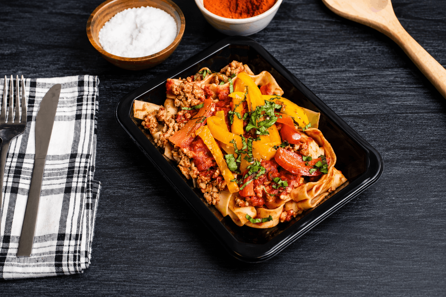 Pappardelle pasta tossed with spicy Italian chicken sausage, sweet bell peppers, and onions in a rich tomato and white wine sauce. Finished with fresh basil and Parmesan for a bold, rustic Italian flavor.