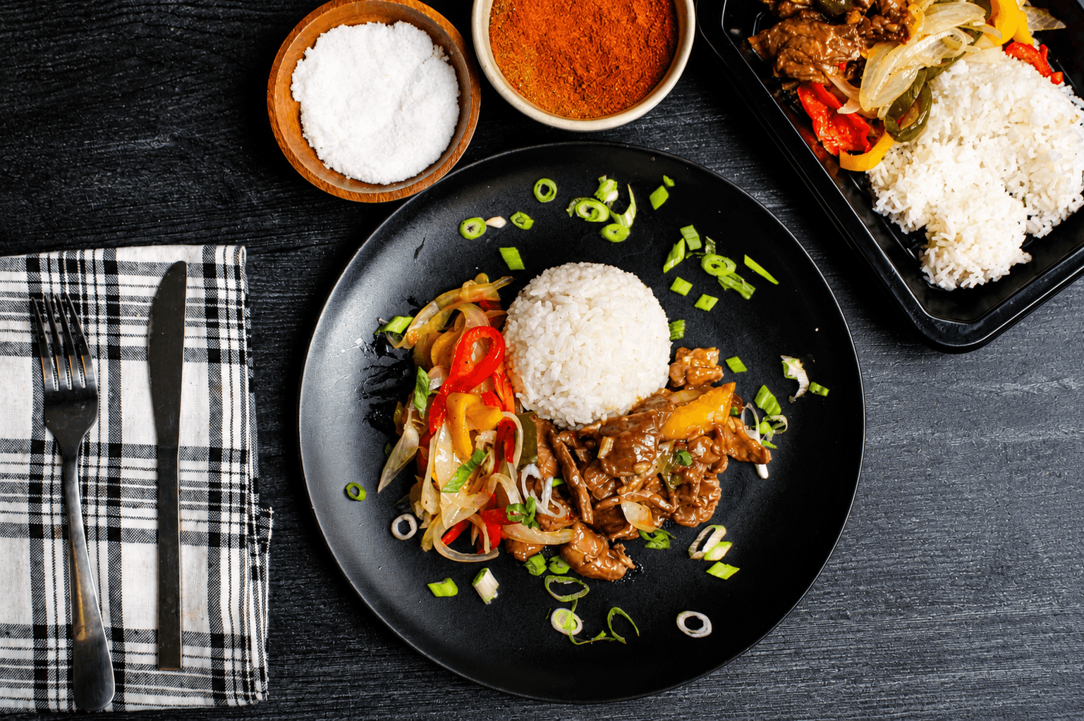 Tender marinated steak, seared to perfection and tossed with sweet bell peppers and caramelized onions in a rich, savory pan sauce. Served over a bed of fluffy jasmine rice for a classic, satisfying meal packed with bold flavor.