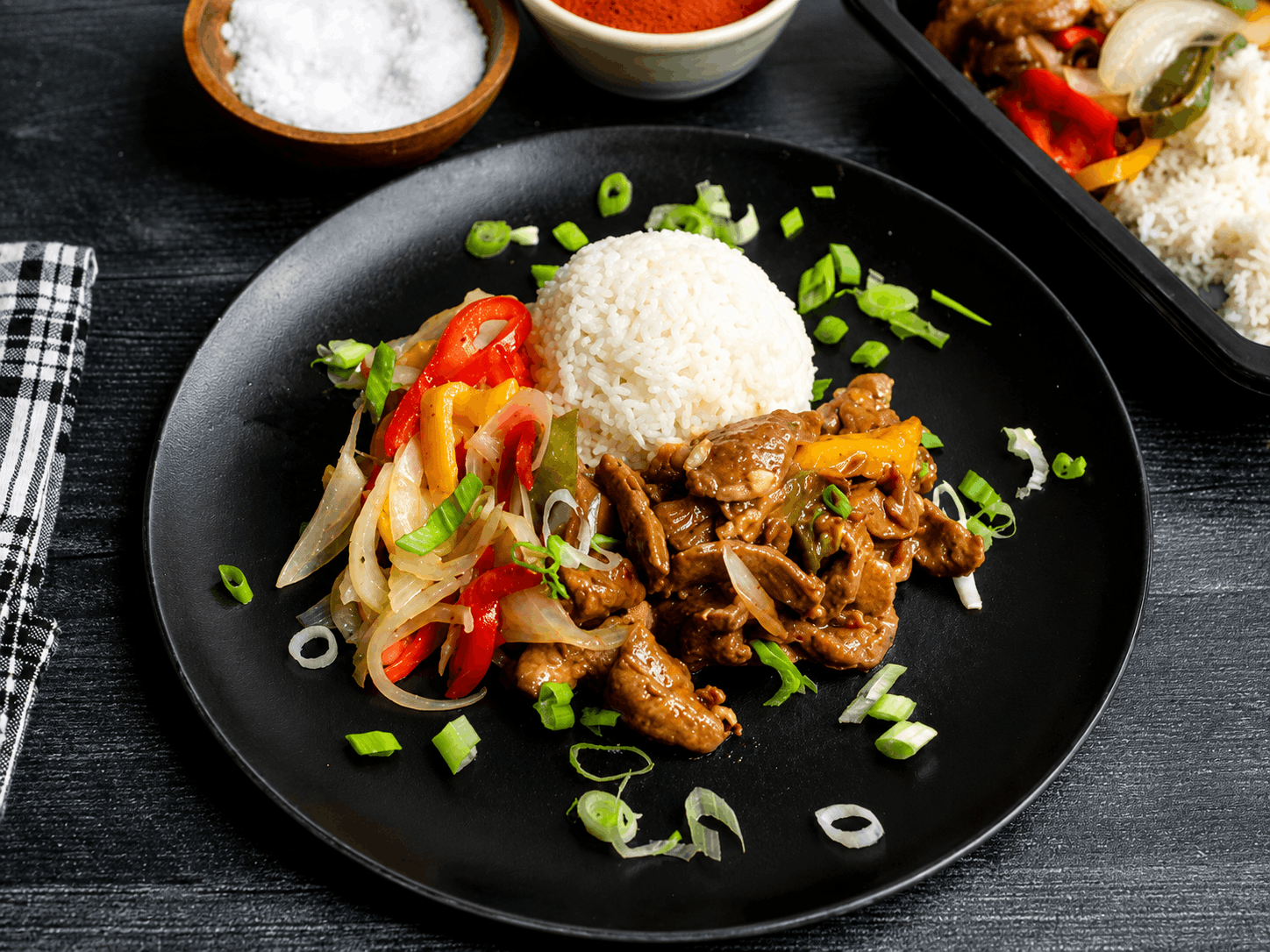 Tender marinated steak, seared to perfection and tossed with sweet bell peppers and caramelized onions in a rich, savory pan sauce. Served over a bed of fluffy jasmine rice for a classic, satisfying meal packed with bold flavor.