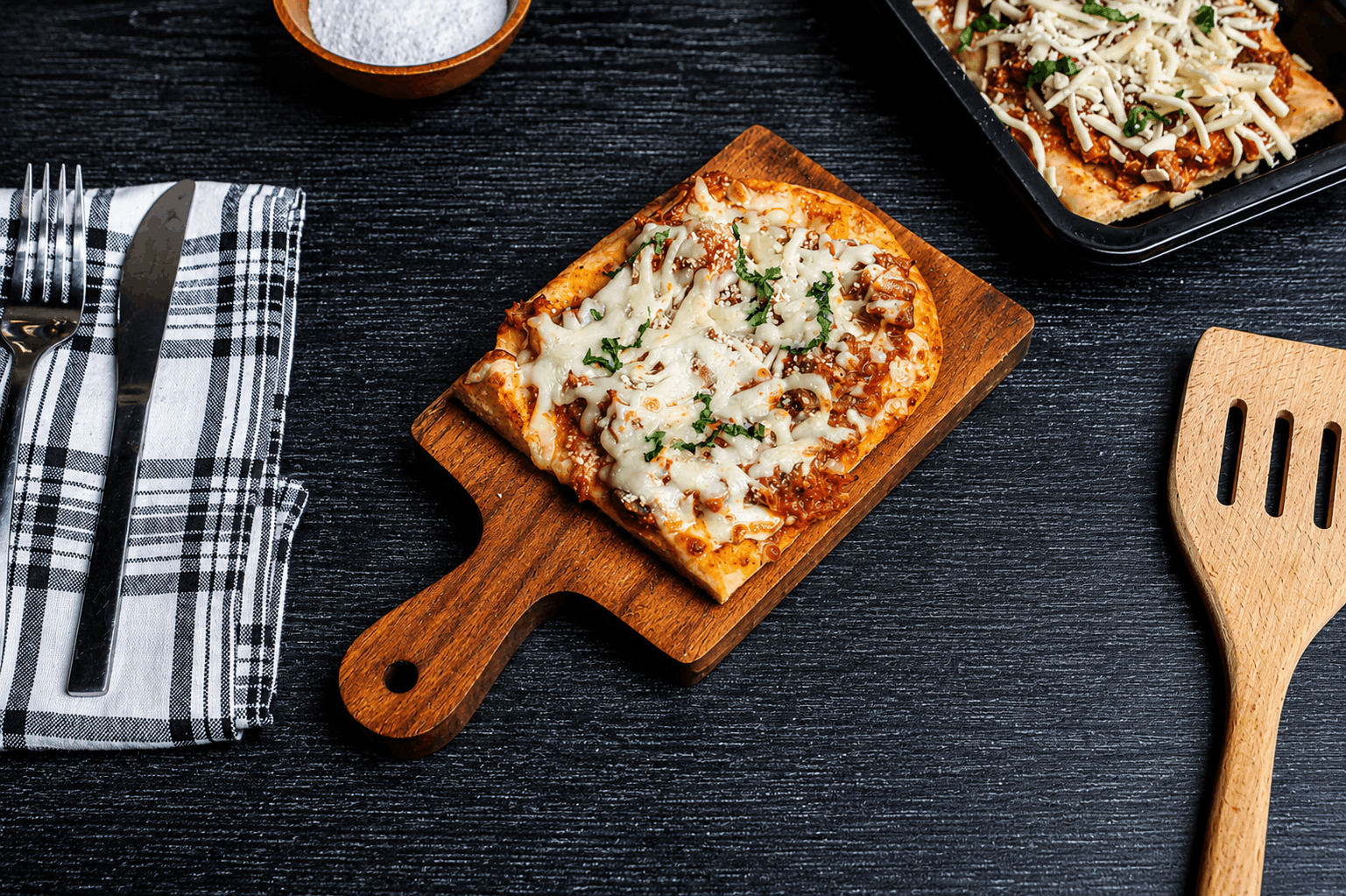 Tender Cuban braised beef in a savory tomato and pepper sofrito, spread over warm flatbread and crowned with melted mozzarella and cotija cheese.