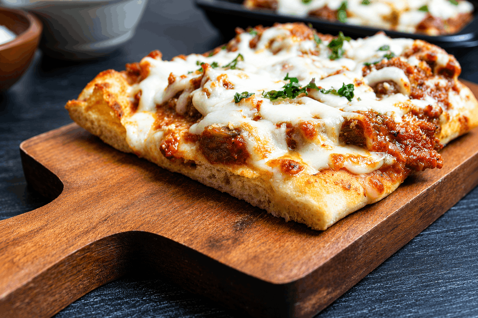 Tender Cuban braised beef in a savory tomato and pepper sofrito, spread over warm flatbread and crowned with melted mozzarella and cotija cheese.