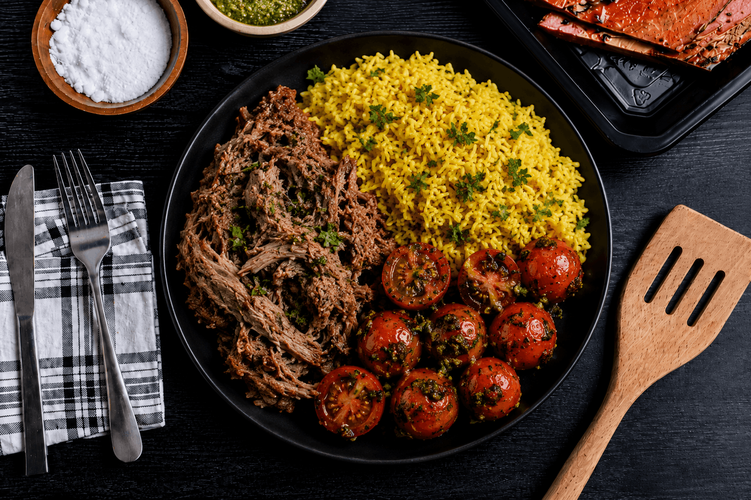 Slow-roasted mojo shredded pork, marinated with garlic, citrus, and traditional Cuban-inspired spices, served with fluffy yellow rice and roasted cherry tomatoes tossed in fresh basil pesto. A bold, savory dish packed with bright flavors and wholesome ingredients.
